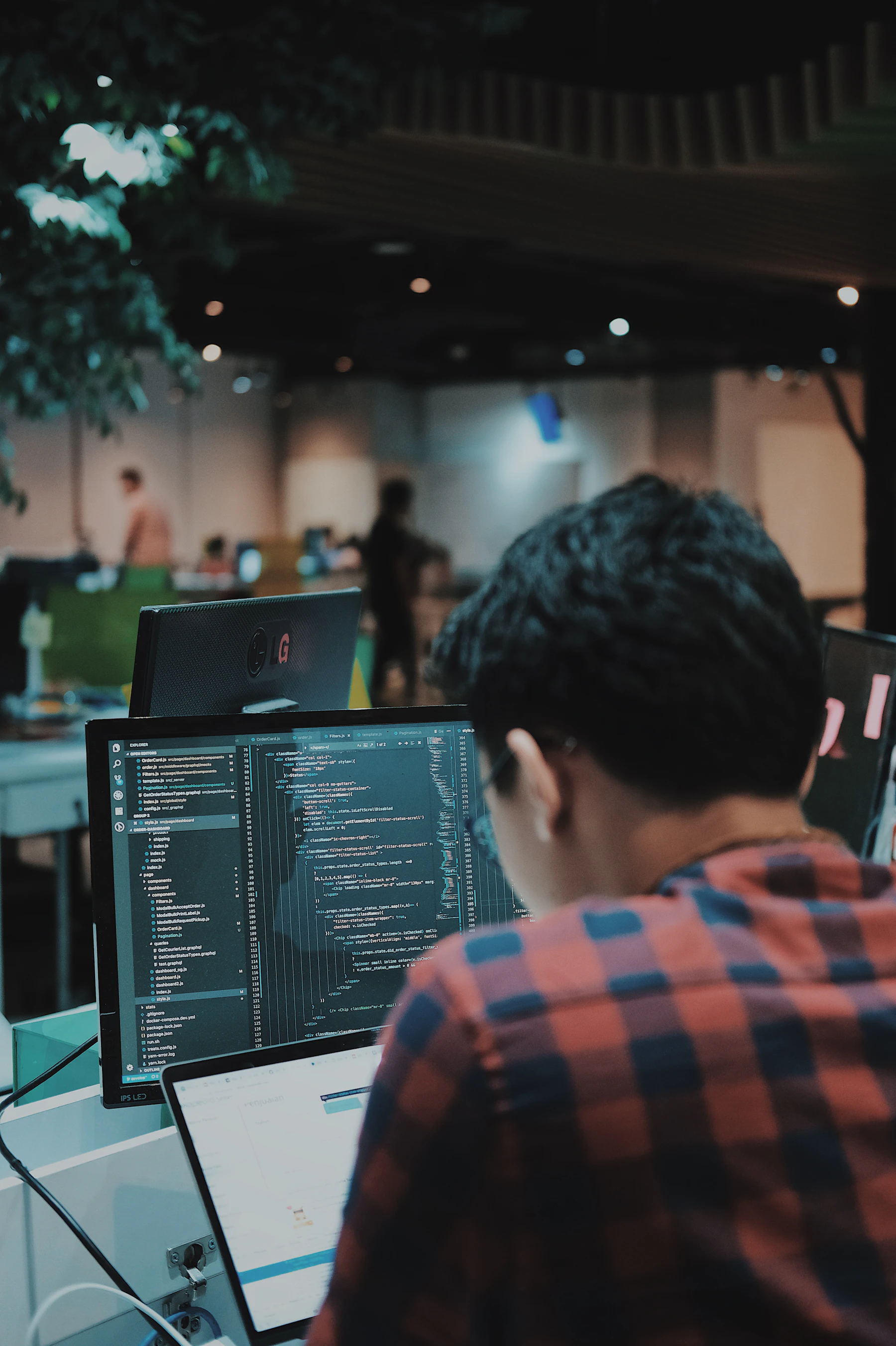 A software engineer working at an enterprise workstation